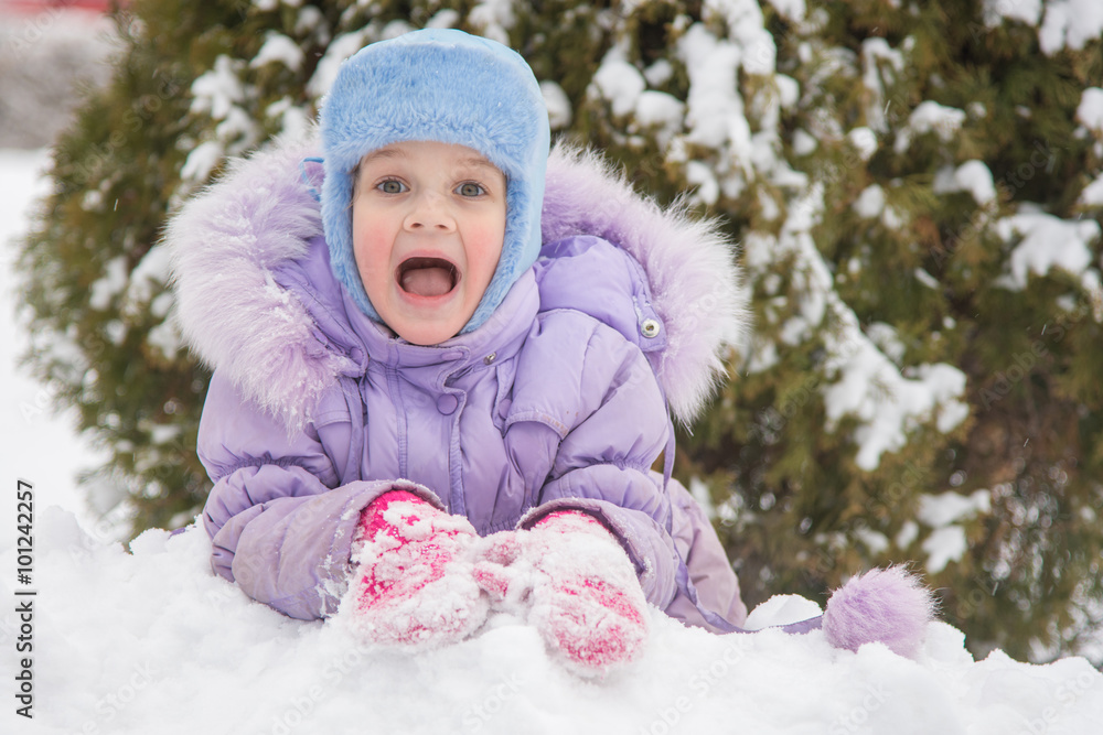 Girl lying in a snowdrift snow Girl lying in a snowdrift snow