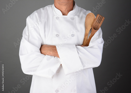 Chef Holding Wood Utensils