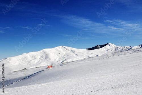 Ski slope at sun day