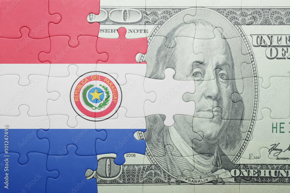 Fototapeta premium puzzle with the national flag of paraguay and dollar banknote