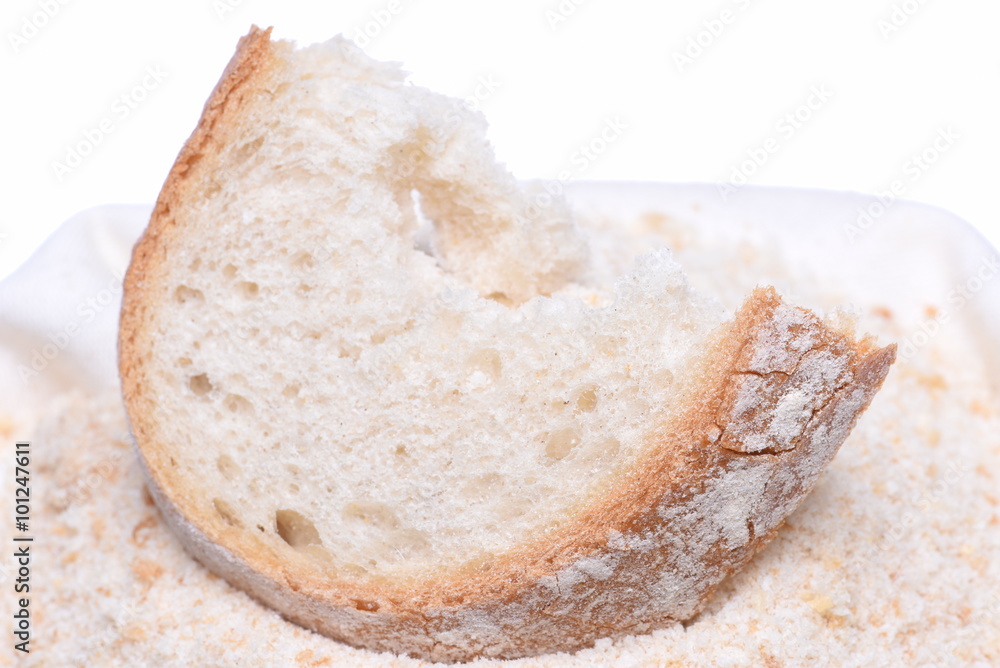 Homemade breadcrumb with slice of bread isolated on white background Homemade breadcrumb with slice of bread isolated on white background