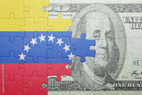 puzzle with the national flag of venezuela and dollar banknote