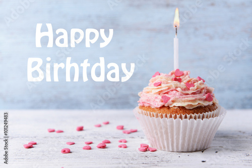 Canvas Print Delicious birthday cupcake on wooden background