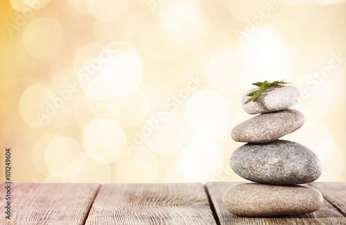 Beautiful composition with spa stones on light background, close up