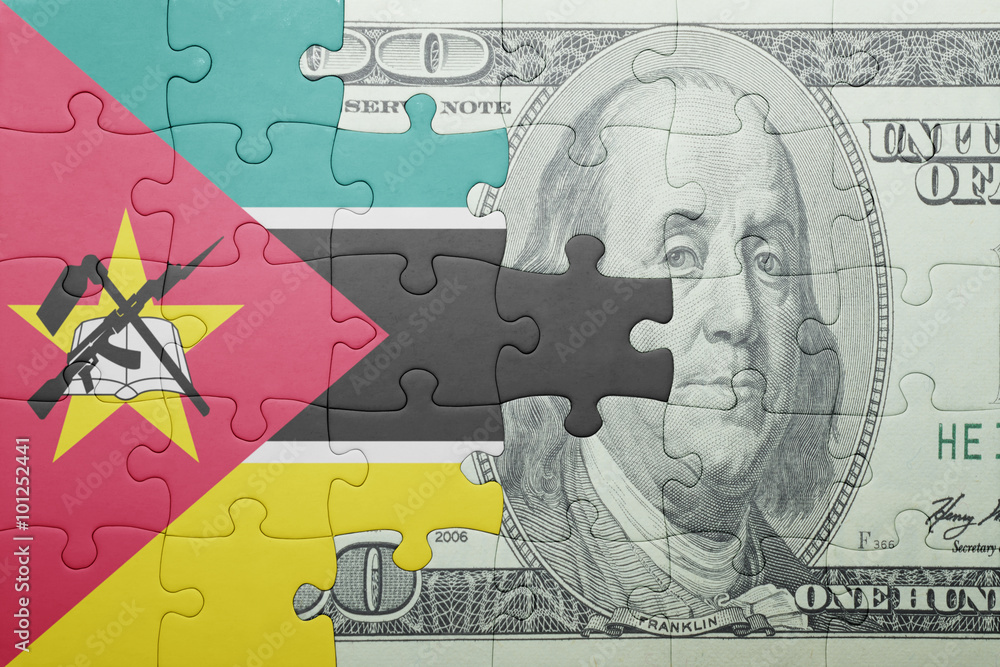 puzzle with the national flag of mozambique and dollar banknote