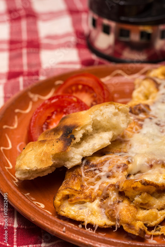Omelet with cheese served and arranged