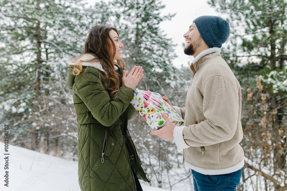 Attractive handsome man gives the gift to his beloved lady for the valentine’s day
Attractive handsome man gives the gift to his beloved lady for the valentine’s day