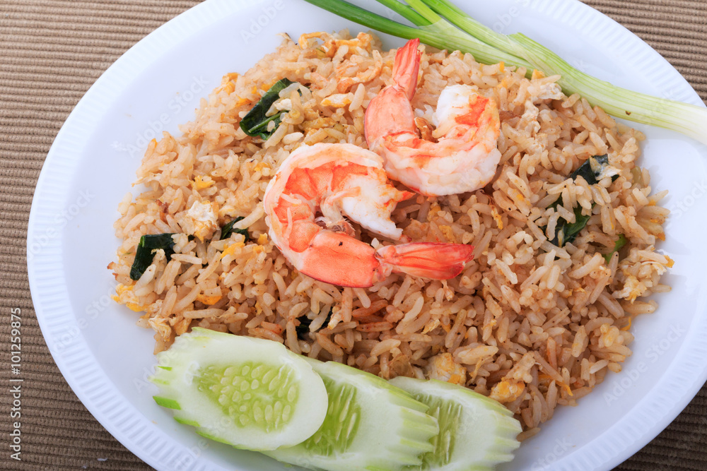 Fried Rice with Shrimp and Vegetables on White Plate and White Background, Thai cuisine Fried Rice with Shrimp and Vegetables on White Plate and White Background, Thai cuisine