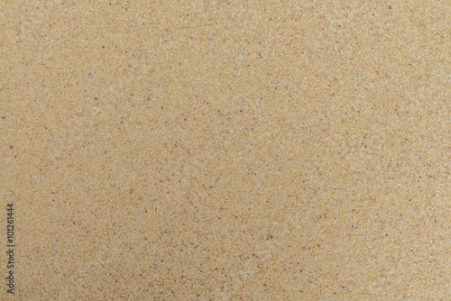 closeup of sand pattern of a beach in the summer. Beach background. Top view