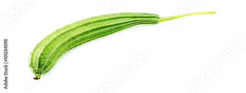 Whole raw ridged gourd with stem against white photo