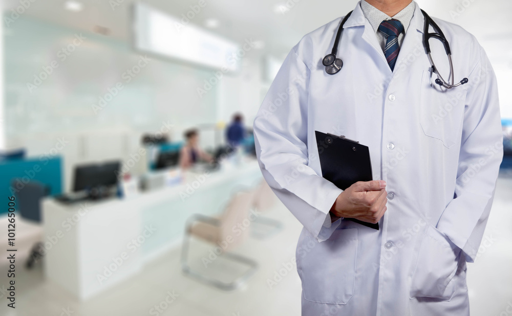 Doctor holding black chart with stethoscope, medical concept Doctor holding black chart with stethoscope, medical concept