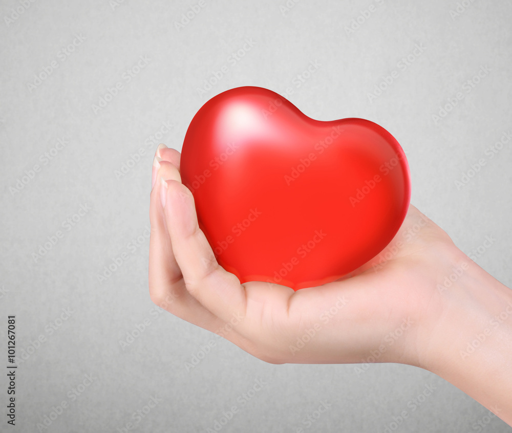 Fototapeta premium Red heart in hands