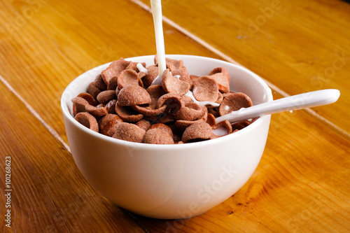 chocolate cerials in a bowl and millk photo