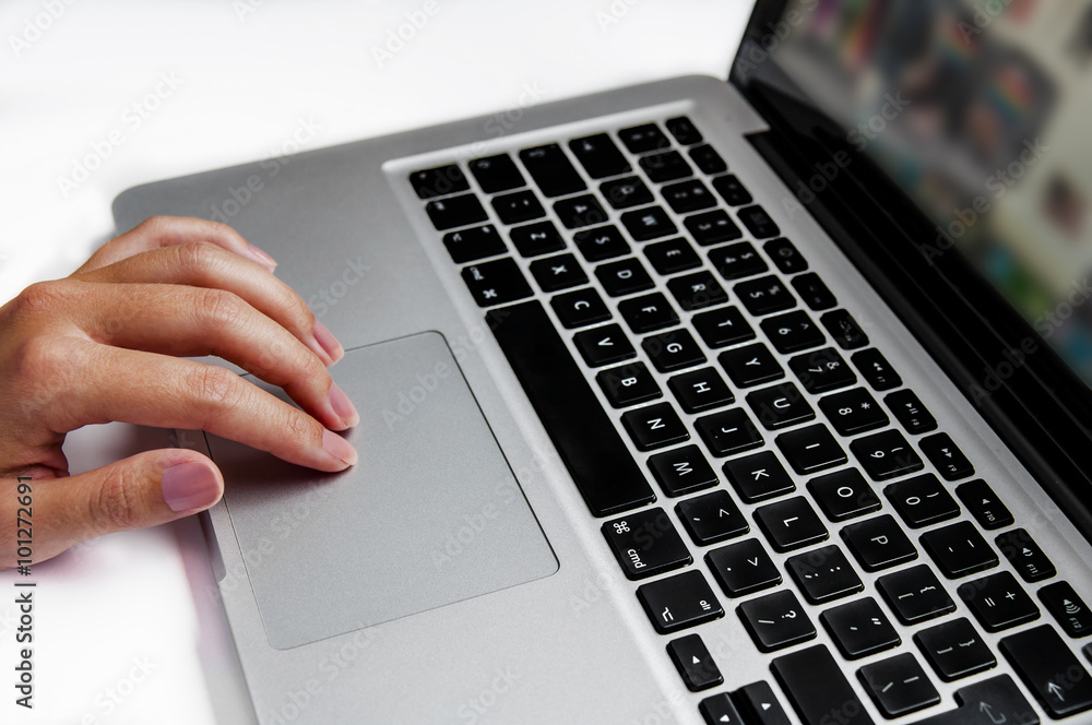 Business woman hand working on blank screen laptop computer on wooden desk as concept Business woman hand working on blank screen laptop computer on wooden desk as concept