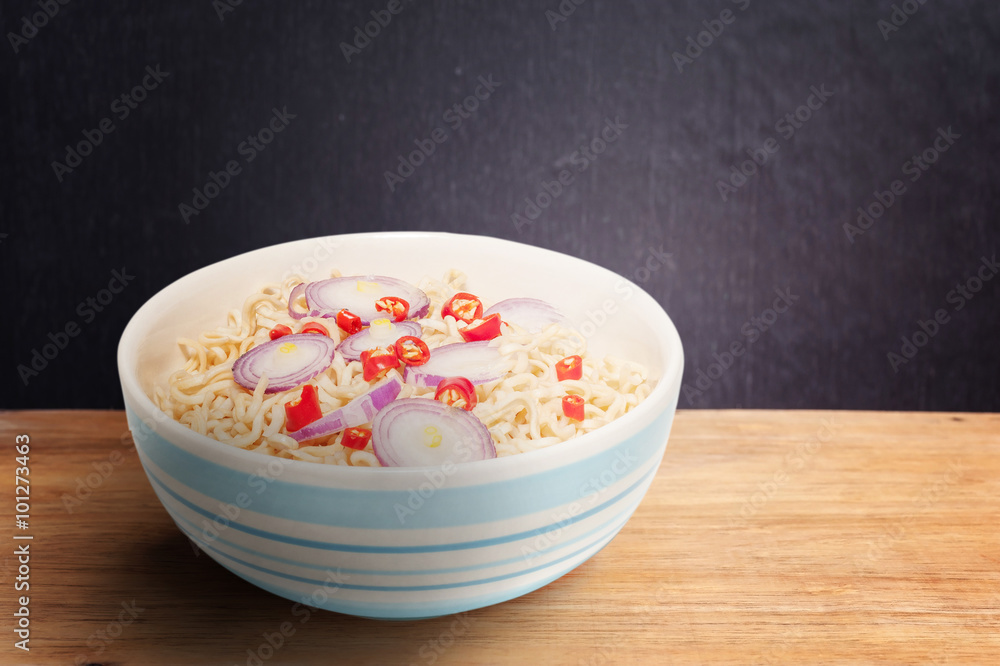 Noodle in bowl on dark wooden background Noodle in bowl on dark wooden background