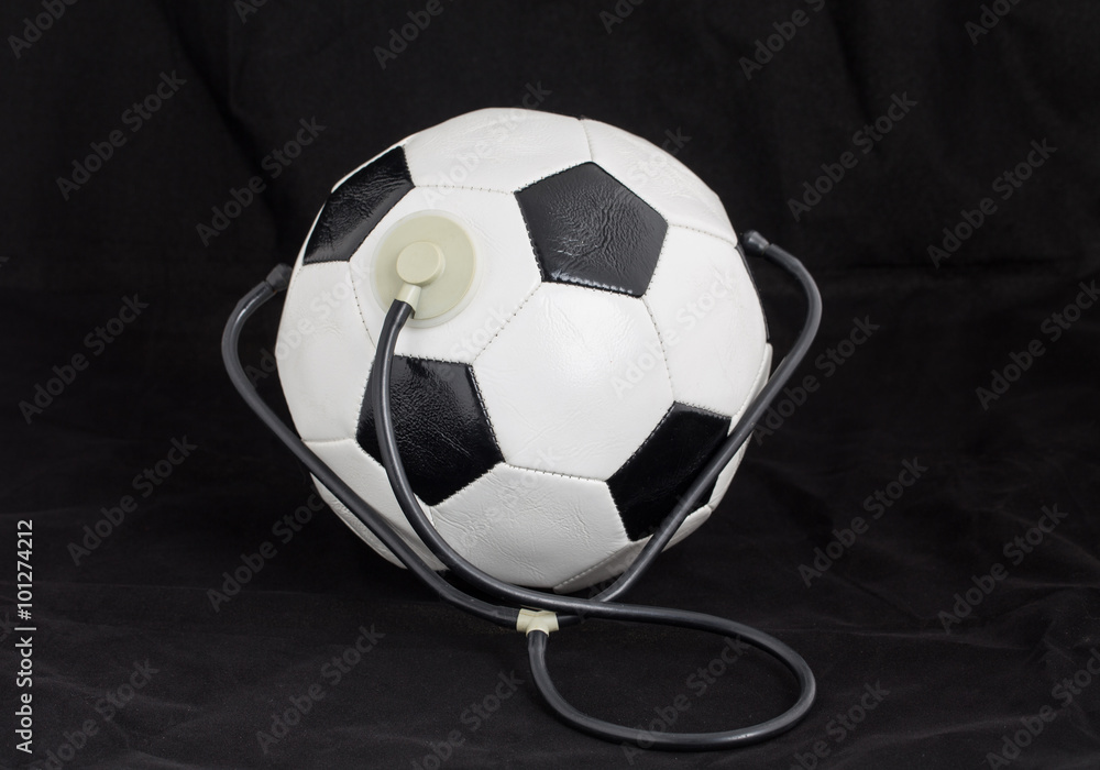 Soccer ball with stethoscope.