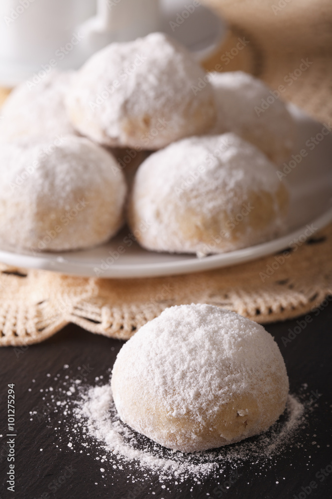 Traditional Mexican polvorón cookies macro on the table. vertical
Traditional Mexican polvorón cookies macro on the table. vertical