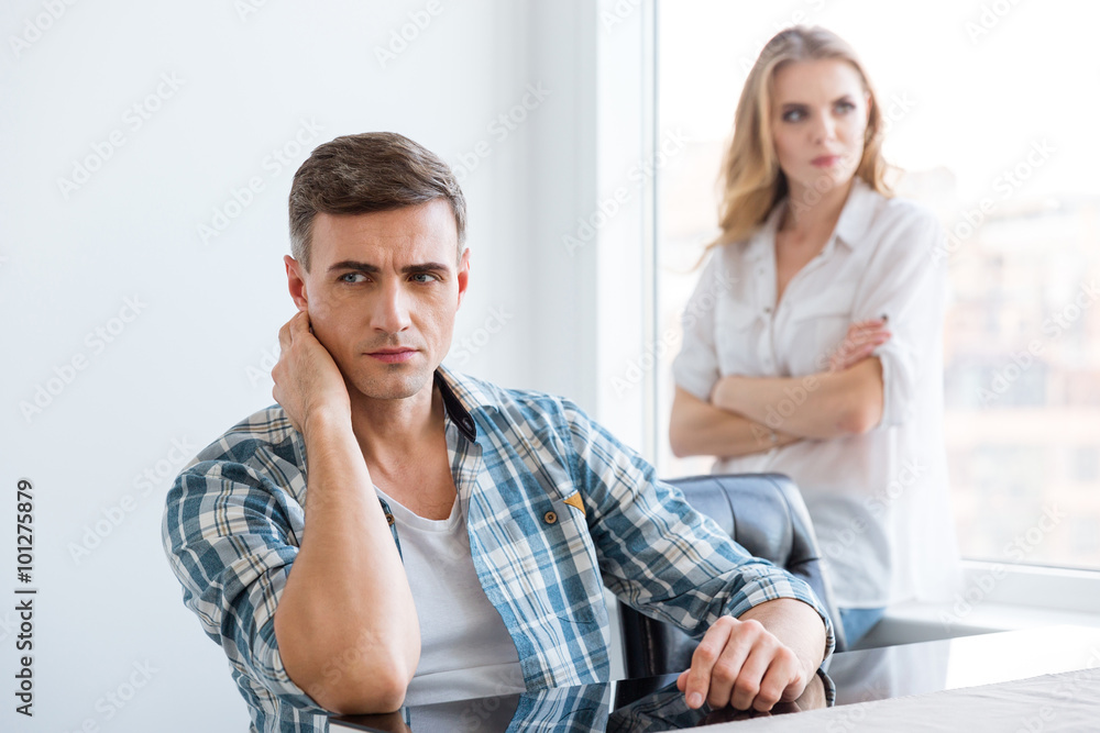 Upset man and woman having problems in relationships Upset man and woman having problems in relationships