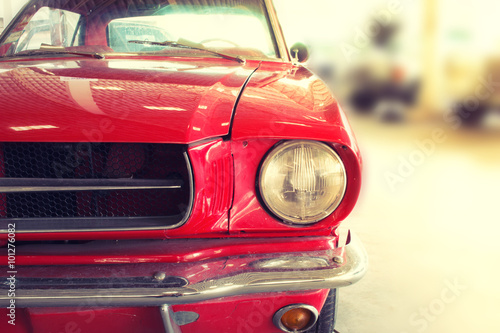Close Up of Front of a Red Vintage Car © wittayayut