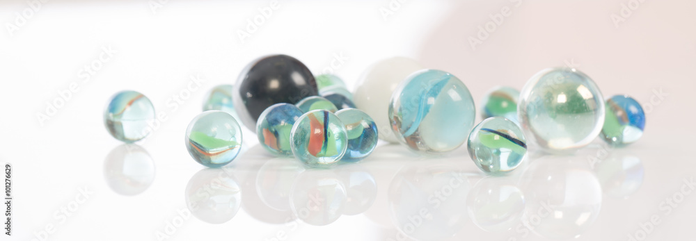 glass marbles balls on white blackground ,selective focus glass marbles balls on white blackground ,selective focus