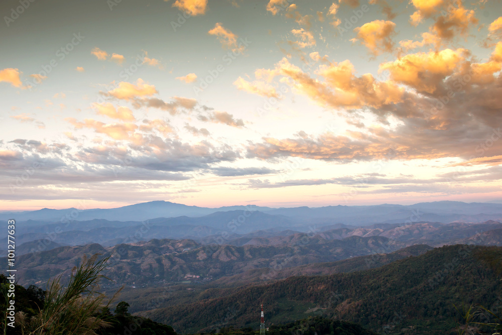 Fototapeta premium Mountain valleys in morning clouds at Sunrise