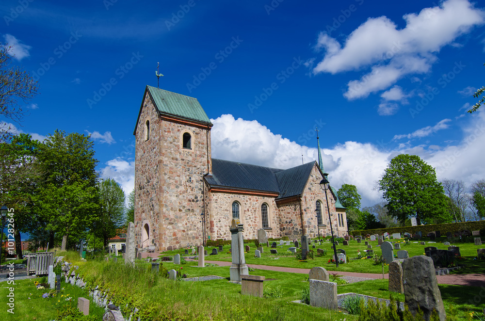 Old sweden church with cemetery in small town near Stockholm - Vallentuna, vivid natural outdoor Sweden background
