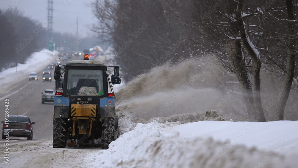 Tractors of road service clean up the snow from the roadside and throw it away
Tractors of road service clean up the snow from the roadside and throw it away