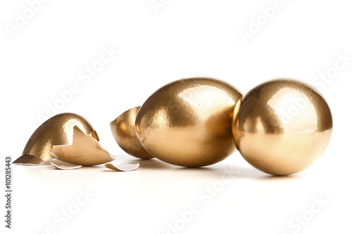 Two Golden Eggs Near The Broken Egg