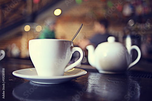 Photography cup of tea at a cafe blurred background