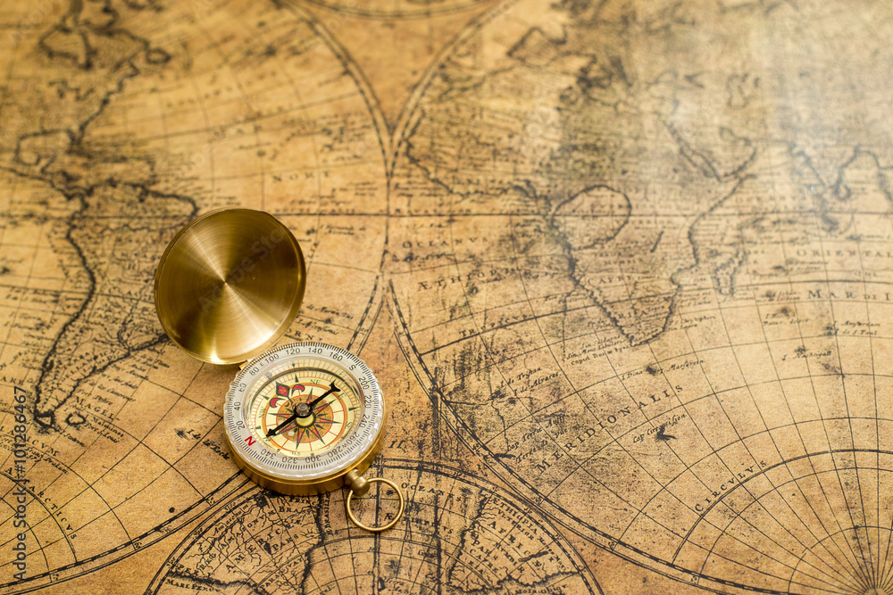 old compass  on vintage map