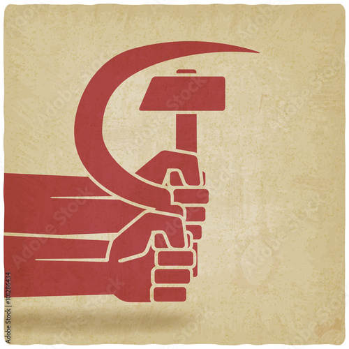 hands with hammer and sickle old background
