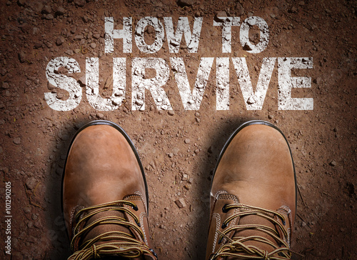 Top View of Boot on the trail with the text: How To Survive photo