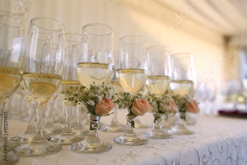 Many glasses of champagne on table