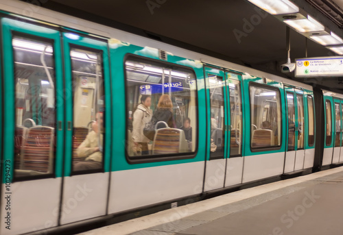 Metro train in a Paris station, France photo