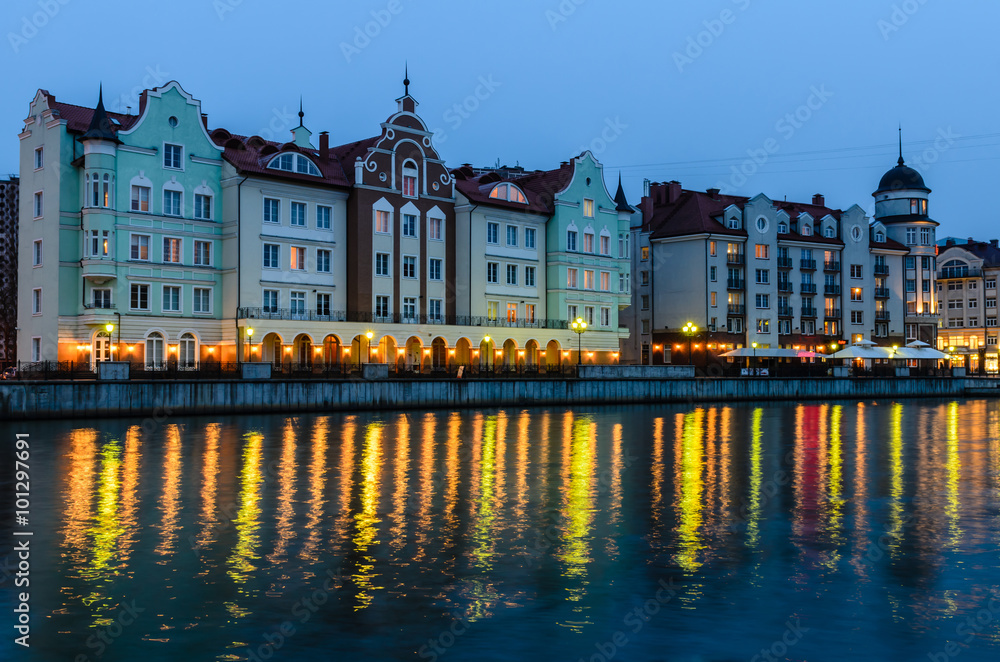 Ethnographic and trade center, embankment of the Fishing Village, night view, Kaliningrad, Russia.