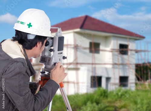 Engineers use tacheometer or theodolite with building constructi photo