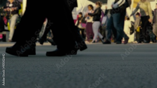 Closeup of busy people walking slowly