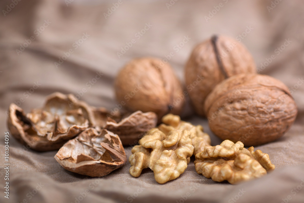 Walnut without shell close-up, and nuts in the shell Walnut without shell close-up, and nuts in the shell