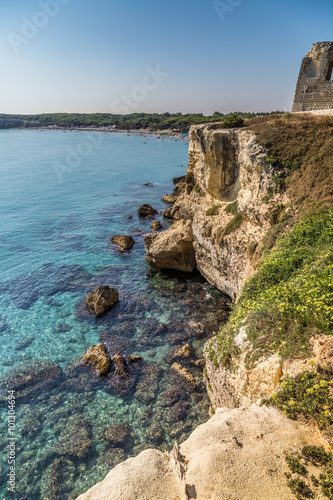 Ruins of watchtower on cove on the coast of Puglia photo