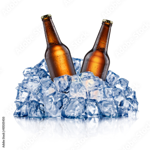 Two cooling beer bottles