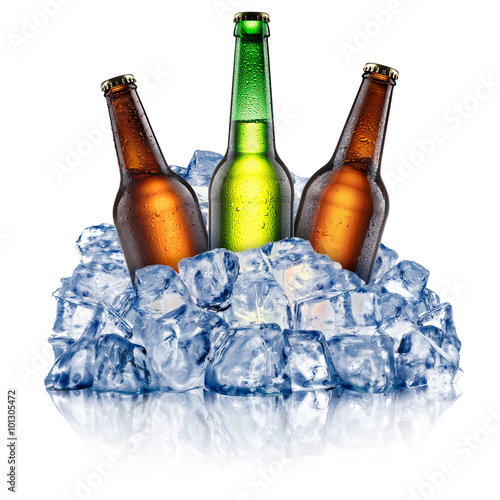 Three cooling beer bottles