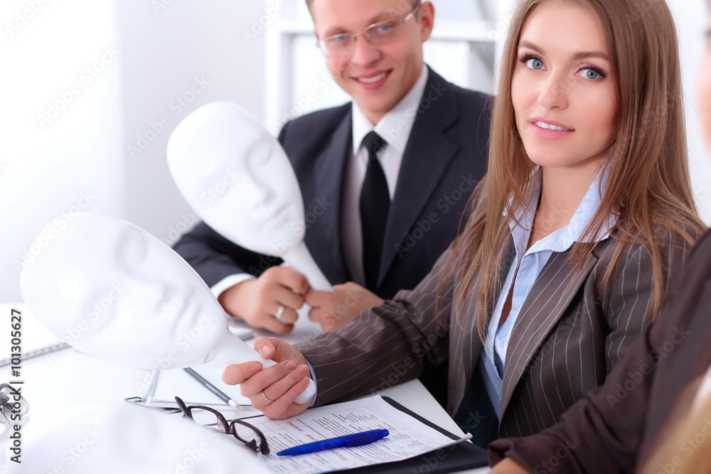Fototapeta premium Group of business people at meeting. Business people hide their emotions under the mask of confidence during the negotiations , business concept
