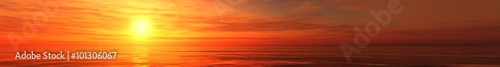 panoramic ocean sunset view of sunrise over the sea, the light in the clouds over the sea. © ustas