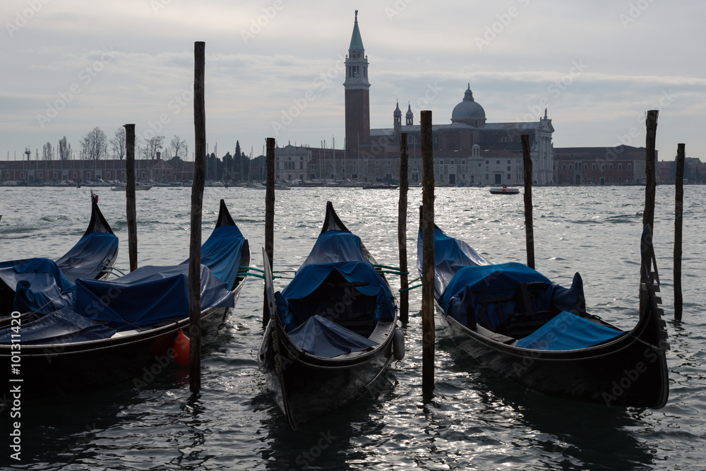 moored gondolas on a canal, Venice, Italy