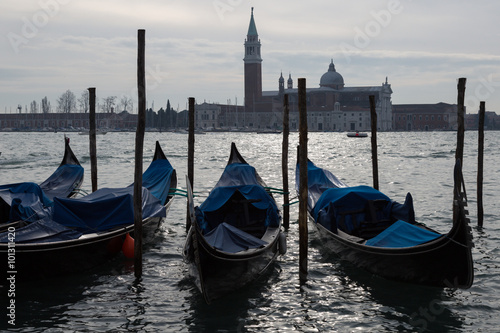 moored gondolas on a canal, Venice, Italy © lindacaldwell