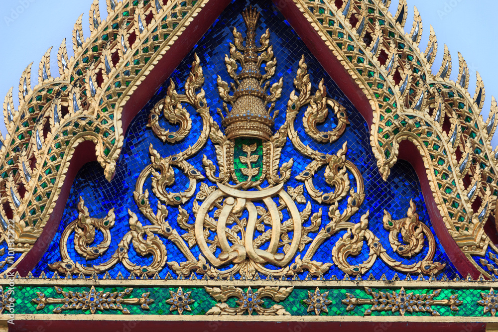 Traditional Thai style Stucco & Naga, Wood Carving Tympanum of Thai Roof Temple at Wat Benchamabopit Dusitvanaram in Bangkok, Thailand