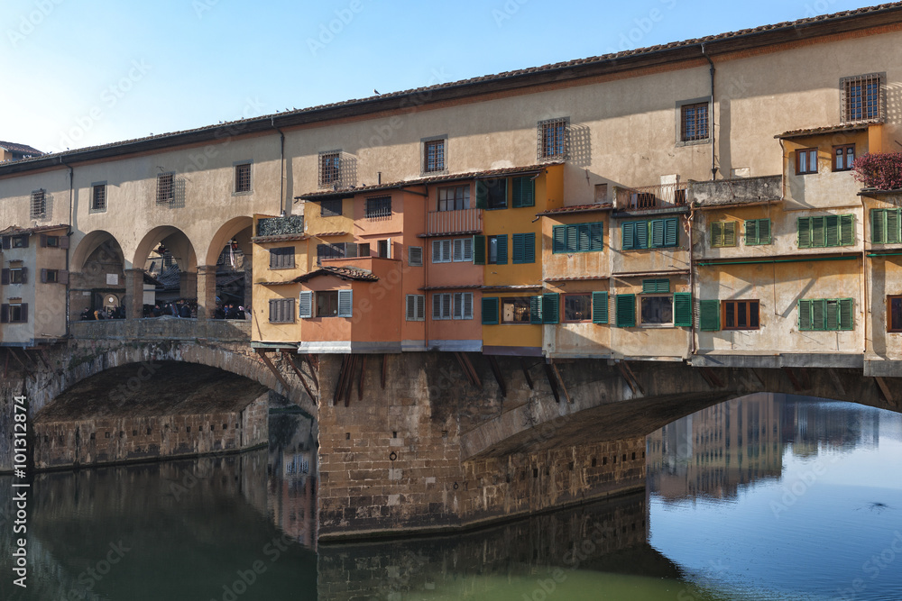 Ponte Vecchio a medieval stone arch bridge over the Arno river, noted for having shops built along it, as was once common; Florence, Italy.
