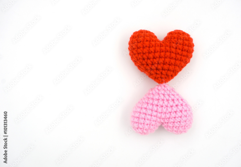 Heart made from yarn on a white background.
