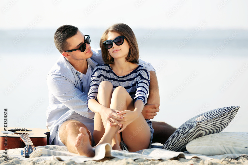Young couple on the riverside