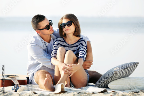 Young couple on the riverside